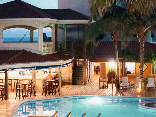 Sunbreeze Hotel at dusk Pool Bar & Restaurant